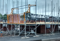 scaffold loading bay with pallet of bricks